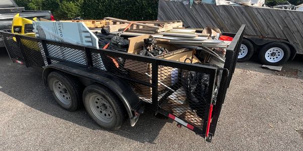 Junk hauling in New Orleans in our 14’ trailer that is more affordable than a dumpster. 
