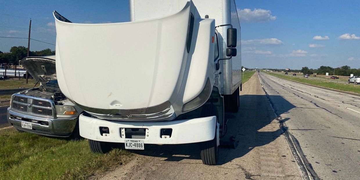 Mobile diesel mechanic diagnosing engine issue on semi truck near San Antonio TX