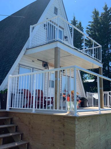 A Home With White Color Railing in the Front
