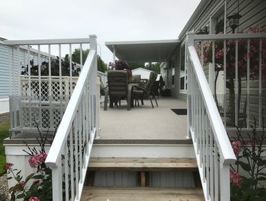 A view of a house with a deck 