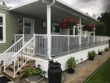 A House Deck Space With White Railing