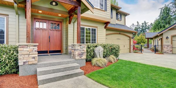 A new house with a green lawn.