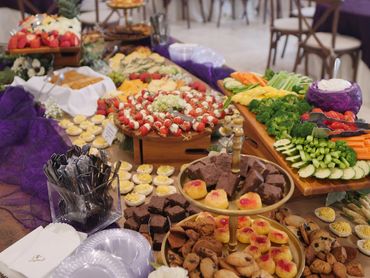 A colorful display of assorted appetizers and finger foods on a buffet table.