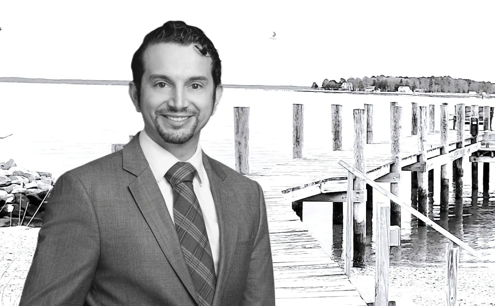 Lawyer in front of a dock over water.