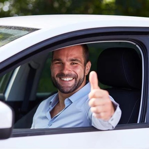 A happy customer at the car wash.