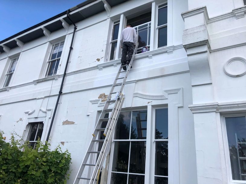 RHS Exterior Painter Painting the Exterior of a Period Building in Worcester 