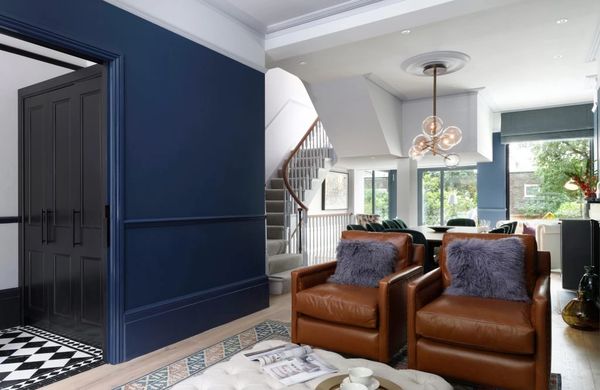 Period property interior with dark blue feature wall