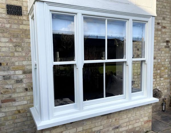 Exterior window joinery painted with a crisp white finish