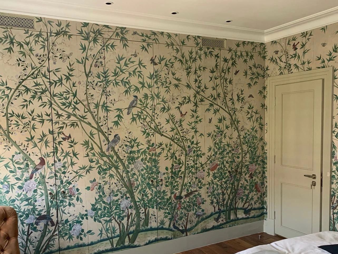 Large botanical mural wallpaper professionally hung in bedroom in Worcester