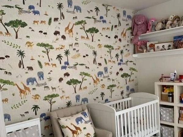 Nursery wallpapering with a clean, precise finish