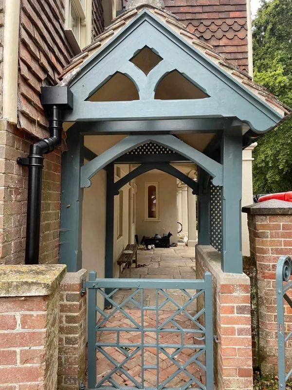 Period entrance porch redecorated with detailed timber finish
