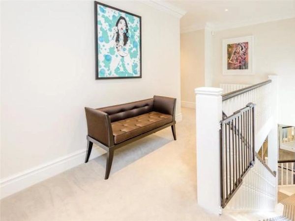 Interior stairs and landing freshly painted in light neutral colours and partley black staircase 