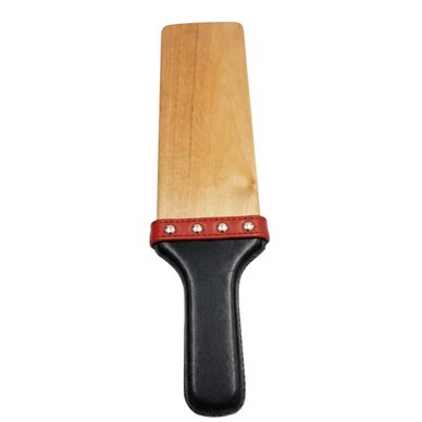 Wooden paddle with a black handle and red trim.