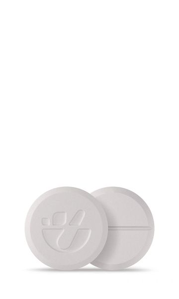 Two white round tablets, one with a logo and one with a score line.
