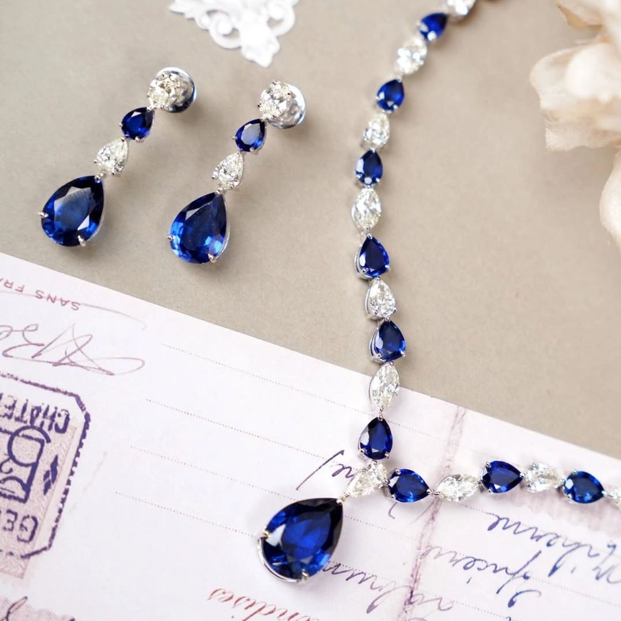Elegant sapphire and diamond necklace with matching earrings.