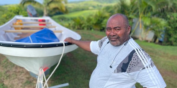 Captain Taniela and the 25 ft fiberglass boat