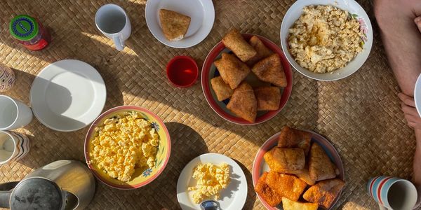 Breakfast option: scrambled eggs, Fijian Bambakau Pancakes, peanut butter, and coffee.