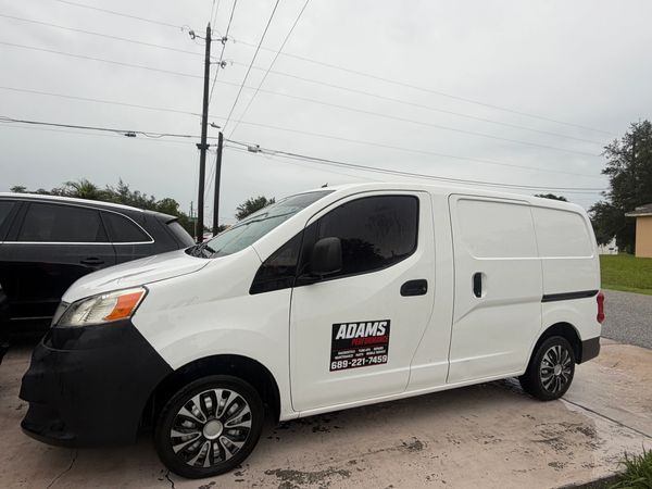White commercial van with Adams Pest Control logo.