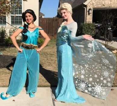 Cosplay princesses Elsa & Jasmine characters at a Pearland Birthday Party outside