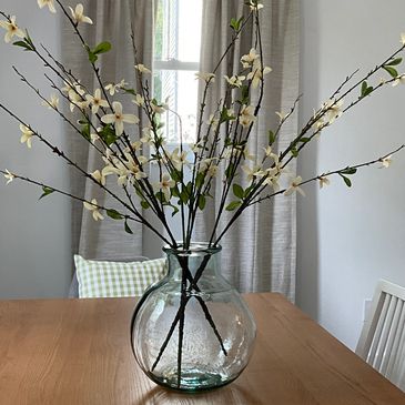 Glass flower pot placed on the table