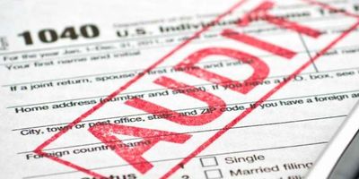 IRS Form 1040 with AUDIT stamped on it