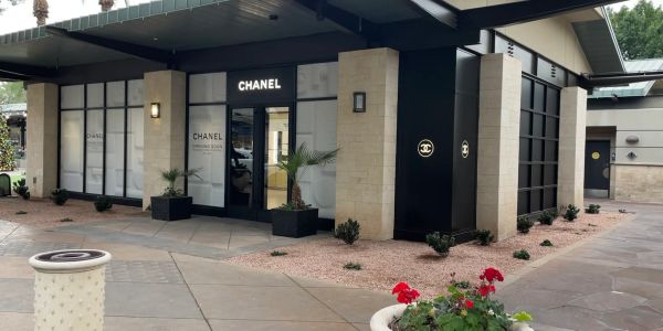 Exterior of a Chanel boutique in a shopping area.
