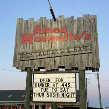 Amos Mosquito's restaurant and bar sign with dinner and sushi night hours.
