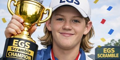 Young golfer proudly holding EGS Scramble Champion trophy.