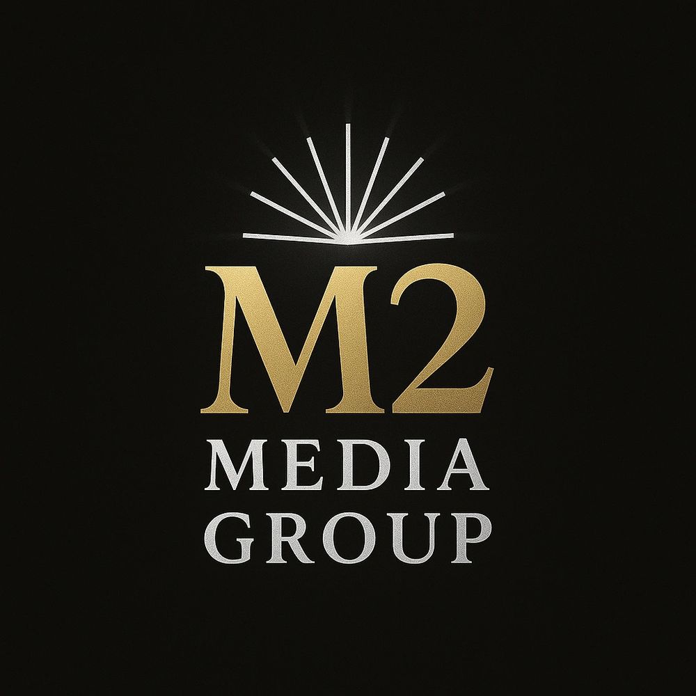 Elegant M2 Media Group logo with gold and silver text on black background.