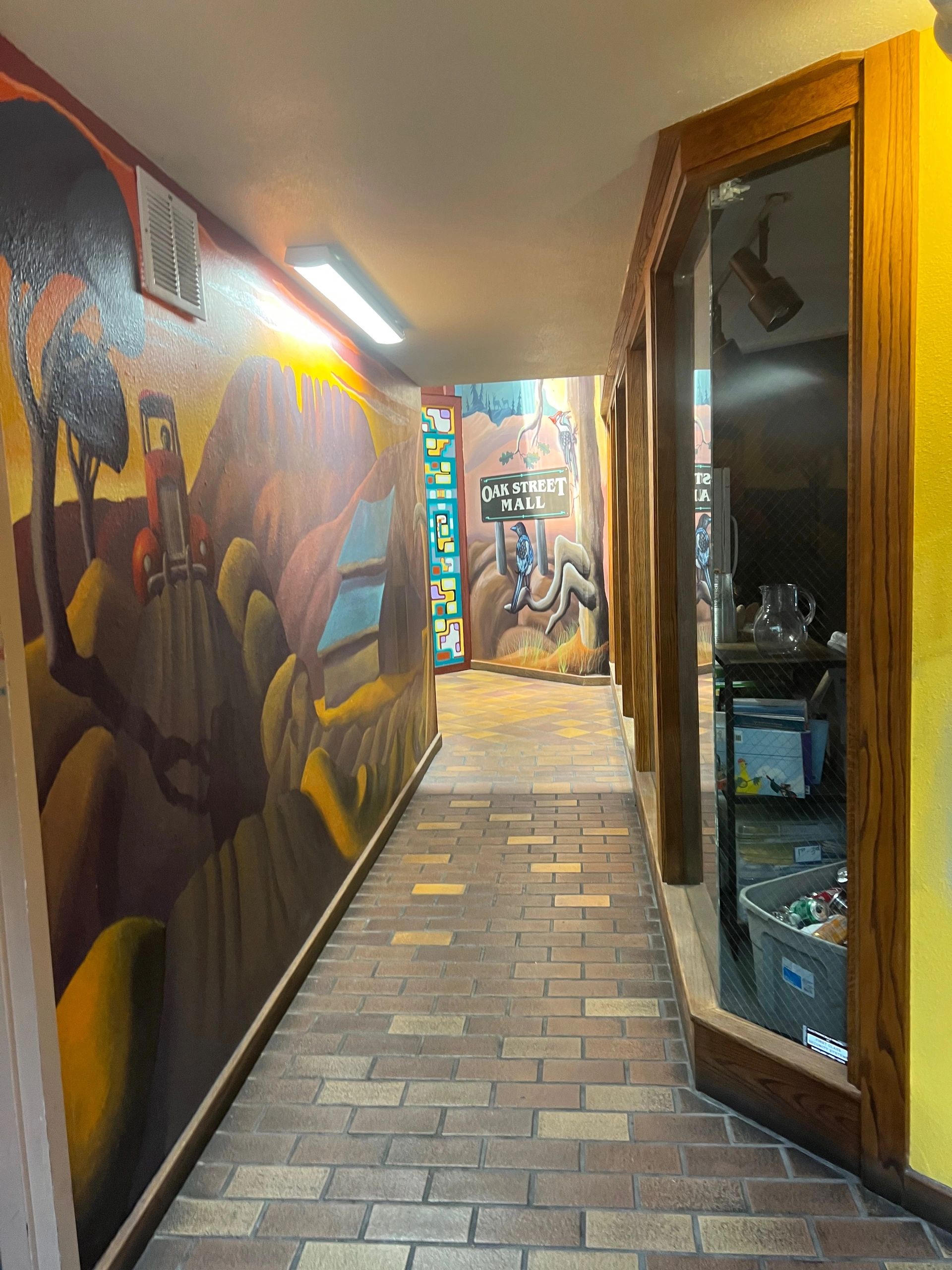 Fun Art Walk Hallway leading to stairs up to The Surrenderance Massage Therapy in Fort Collins, CO