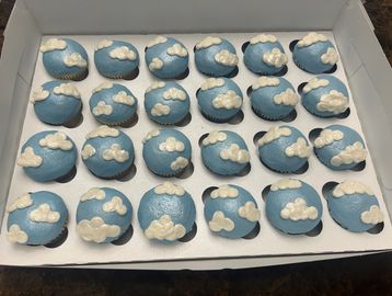 Rounded cupcakes with buttercream clouds