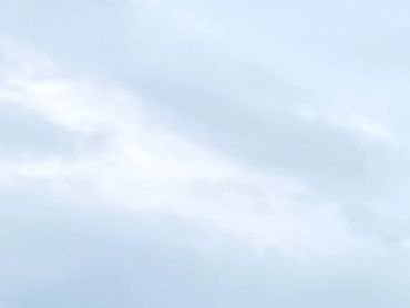 Overcast sky with soft, light gray clouds.