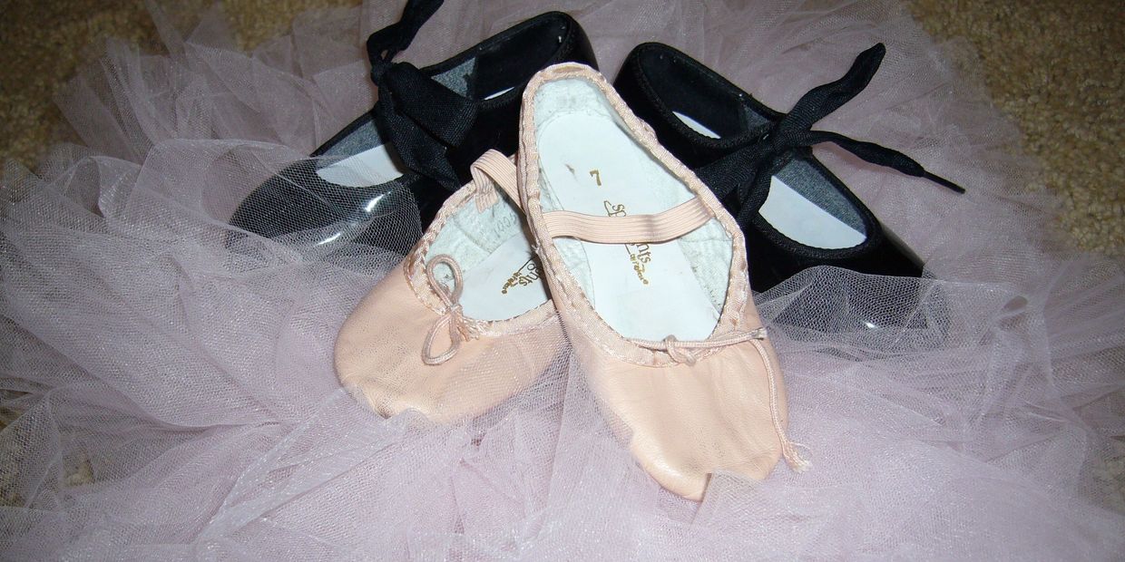 children's ballet and tap shoes on tutu