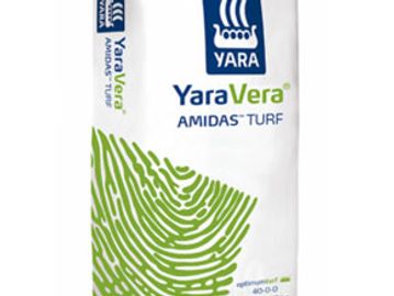 Bag of Yara Vera Amidas Turf fertilizer with green fingerprint design.