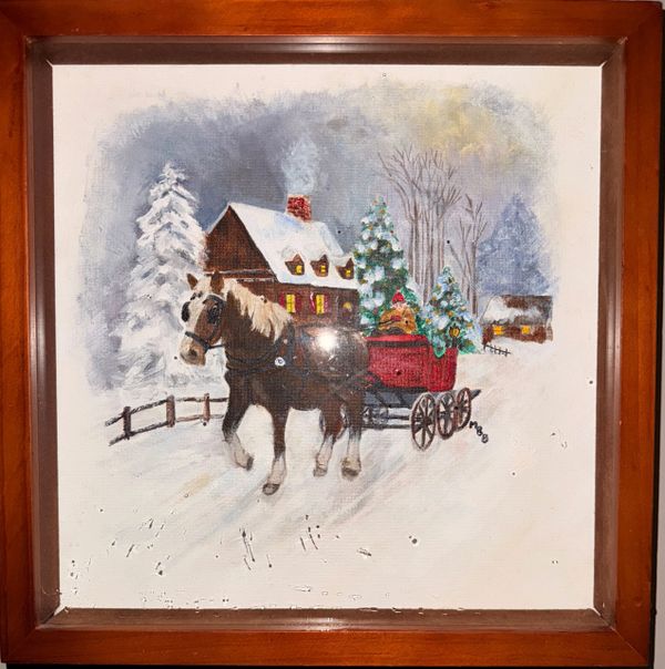 Horse pulling a sleigh with Christmas trees in a snowy landscape near houses.