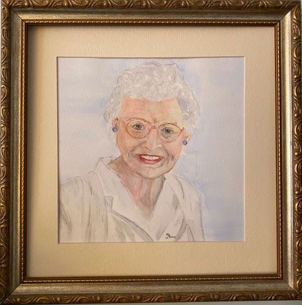 Framed watercolor portrait of an elderly woman with white hair and glasses.