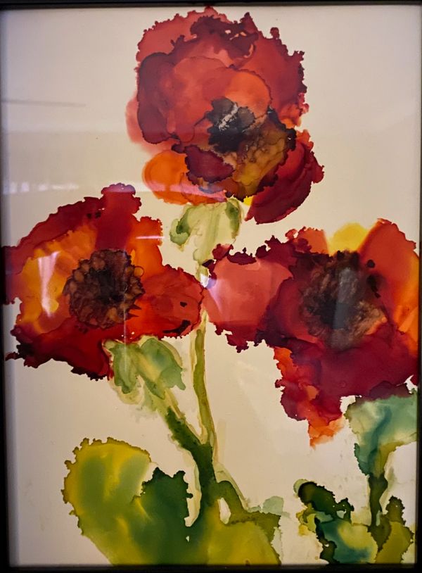 Abstract watercolor painting of vibrant red flowers with green stems and leaves.