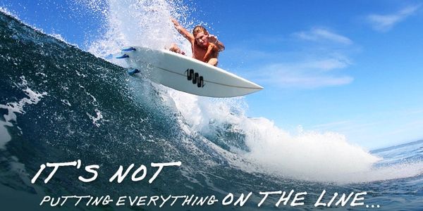 Surfer riding a wave with motivational text.