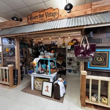 Entrance of a vintage shop with various items on display.