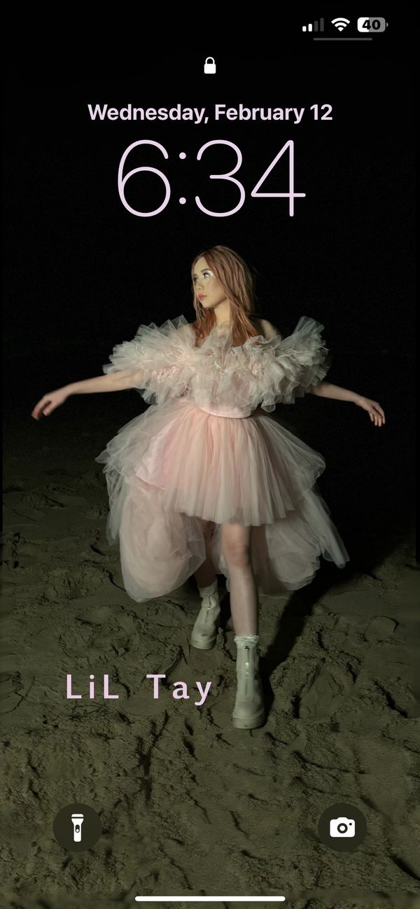 LiL Tay on the beach dancing at night 