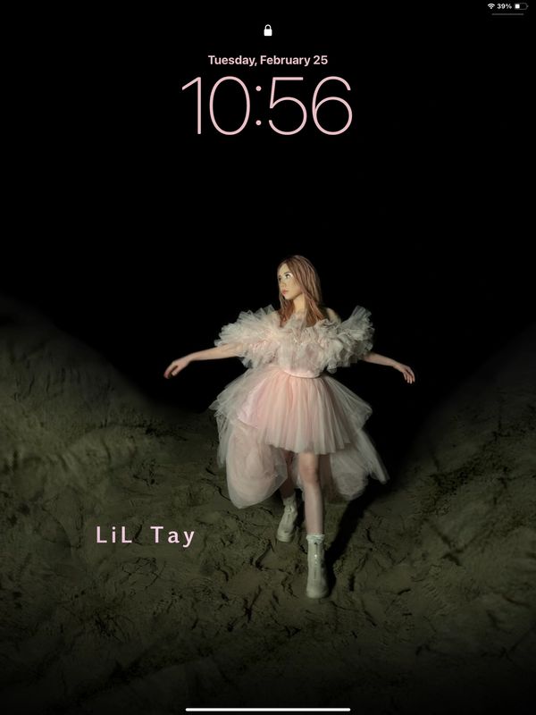 Lil Tay growing up music video at beach during night time 