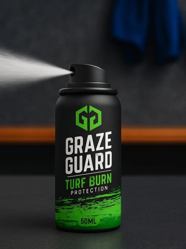 Black and green spray can labeled Graze Guard Turf Burn Protection spraying mist.