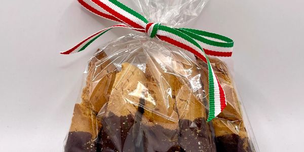 Biscotti dipped in chocolate, packaged with an Italian flag ribbon.