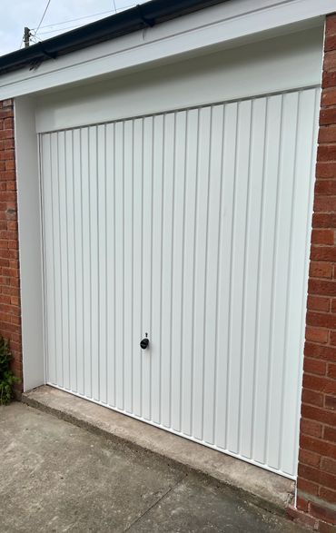 While Hormann Canopy door with white upvc surround