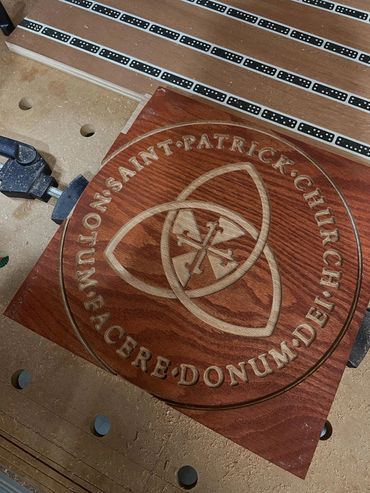 Engraved piece of wood on a workbench 