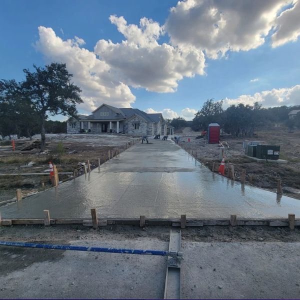 Best Concrete Contractor's in Canyon Lake, Texas, finishing a Extra Large Driveway and Sidewalk.