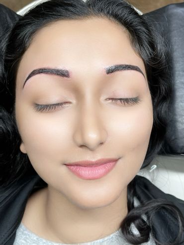 a woman closing her eyes and relaxing