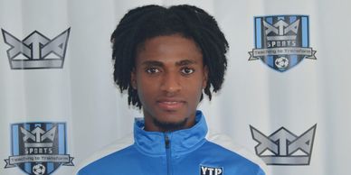 Young man in a sports jacket posing.