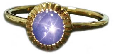 An 18kt Yellow Gold Ring
set with a Star Sapphire