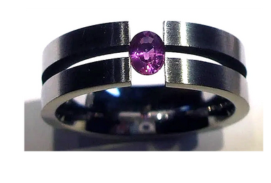 A Steel Tension Ring
set with a Purple Sapphire